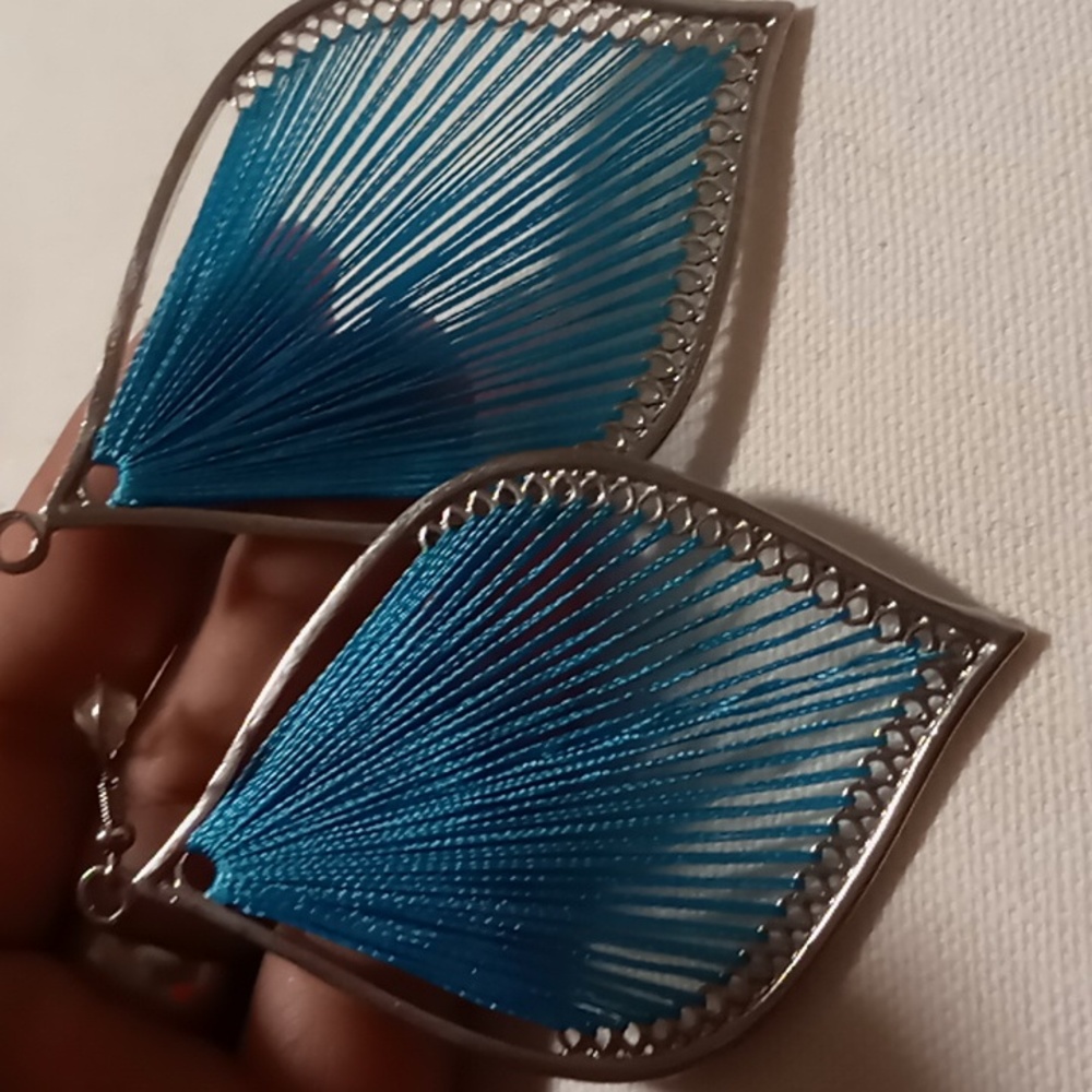 Blue feather silk string & silver tone dangling earrings .